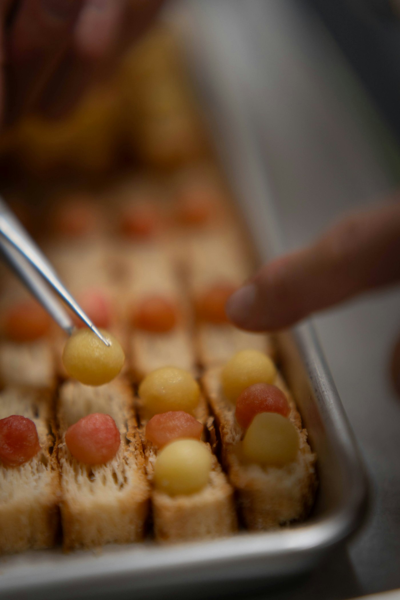 Chef garnishing canapés